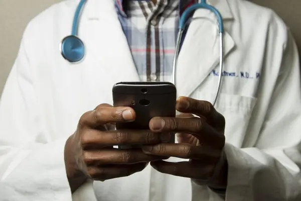 Healthcare professional reviewing digital marketing strategy on tablet