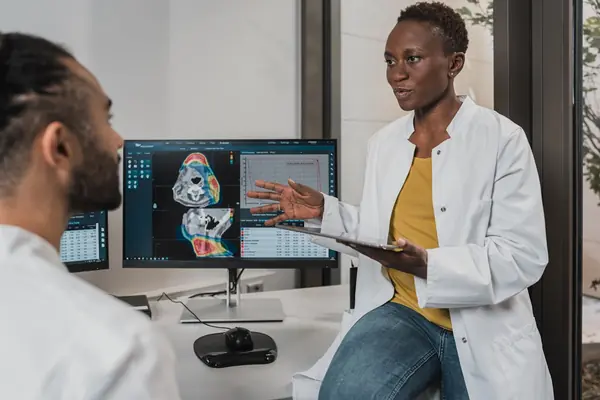 Doctor reviewing online presence and search rankings on computer